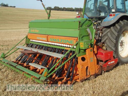 Amazone RPD 301 3m close spacing seed drill c/w following harrow, press wheels, markers, tramline equipment, hopper extension mounted on Kuhn HA3000 reciprocating harrow, both 1996