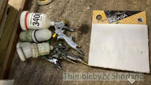 4 spray guns and mixing paper