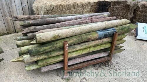 Stillage of wooden fence posts