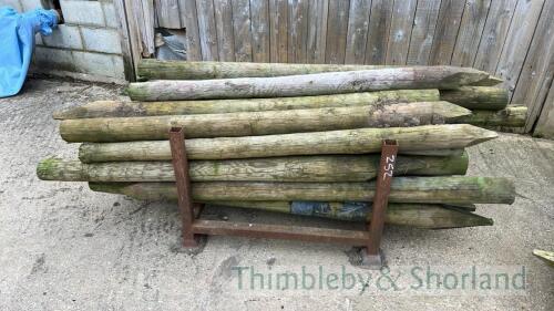 Stillage of wooden fence posts