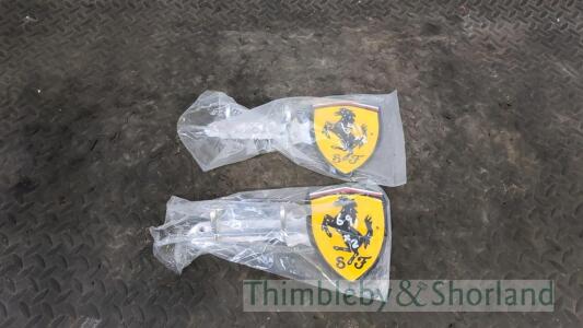 2 Ferrari coat hook signs