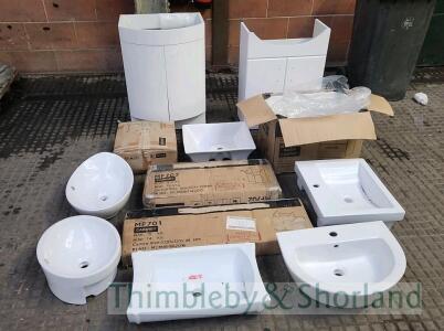 Pallet of ceramic basins and cabinets