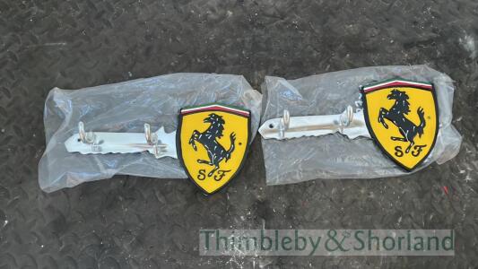 2 Ferrari coat hook signs